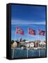 Norwegian Flags and Historic Harbour Warehouses, Stavanger, Norway, Scandinavia, Europe-Christian Kober-Framed Stretched Canvas