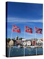 Norwegian Flags and Historic Harbour Warehouses, Stavanger, Norway, Scandinavia, Europe-Christian Kober-Stretched Canvas