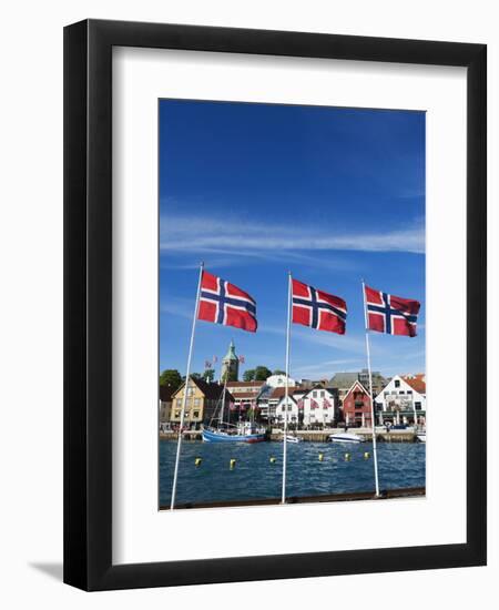 Norwegian Flags and Historic Harbour Warehouses, Stavanger, Norway, Scandinavia, Europe-Christian Kober-Framed Premium Photographic Print