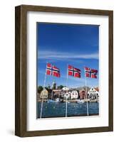 Norwegian Flags and Historic Harbour Warehouses, Stavanger, Norway, Scandinavia, Europe-Christian Kober-Framed Photographic Print