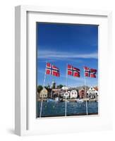 Norwegian Flags and Historic Harbour Warehouses, Stavanger, Norway, Scandinavia, Europe-Christian Kober-Framed Photographic Print