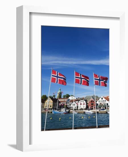 Norwegian Flags and Historic Harbour Warehouses, Stavanger, Norway, Scandinavia, Europe-Christian Kober-Framed Photographic Print