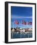 Norwegian Flags and Historic Harbour Warehouses, Stavanger, Norway, Scandinavia, Europe-Christian Kober-Framed Photographic Print