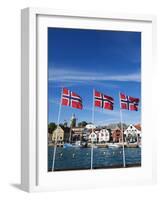 Norwegian Flags and Historic Harbour Warehouses, Stavanger, Norway, Scandinavia, Europe-Christian Kober-Framed Photographic Print