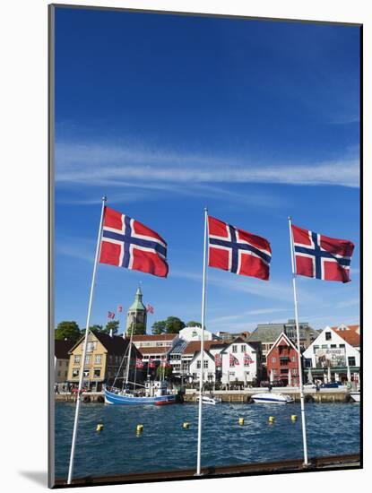 Norwegian Flags and Historic Harbour Warehouses, Stavanger, Norway, Scandinavia, Europe-Christian Kober-Mounted Photographic Print