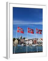 Norwegian Flags and Historic Harbour Warehouses, Stavanger, Norway, Scandinavia, Europe-Christian Kober-Framed Photographic Print