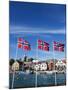 Norwegian Flags and Historic Harbour Warehouses, Stavanger, Norway, Scandinavia, Europe-Christian Kober-Mounted Photographic Print