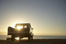 Rear View of Young Couple in Pick-Up Truck Parked in Front of Ocean Enjoying Sunset-Nosnibor137-Photographic Print