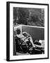 Novelist and Script Writer William Faulkner Reading on His Hotel Balcony-null-Framed Premium Photographic Print