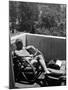 Novelist and Script Writer William Faulkner Reading on His Hotel Balcony-null-Mounted Premium Photographic Print