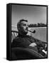 Novelist and Script Writer William Faulkner Smoking a Pipe on the Balcony of His Hotel Room-null-Framed Stretched Canvas