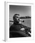 Novelist and Script Writer William Faulkner Smoking a Pipe on the Balcony of His Hotel Room-null-Framed Premium Photographic Print