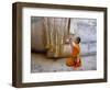 Novice Buddhist Monk Kneeling Beneath the Phra Atchana Buddha Statue, Sukhothai Province, Thailand-Gavin Hellier-Framed Photographic Print