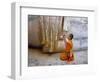 Novice Buddhist Monk Kneeling Beneath the Phra Atchana Buddha Statue, Sukhothai Province, Thailand-Gavin Hellier-Framed Photographic Print