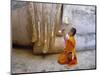 Novice Buddhist Monk Kneeling Beneath the Phra Atchana Buddha Statue, Sukhothai Province, Thailand-Gavin Hellier-Mounted Photographic Print