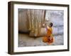 Novice Buddhist Monk Kneeling Beneath the Phra Atchana Buddha Statue, Sukhothai Province, Thailand-Gavin Hellier-Framed Photographic Print