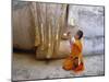 Novice Buddhist Monk Kneeling Beneath the Phra Atchana Buddha Statue, Sukhothai Province, Thailand-Gavin Hellier-Mounted Photographic Print