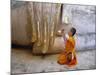 Novice Buddhist Monk Kneeling Beneath the Phra Atchana Buddha Statue, Sukhothai Province, Thailand-Gavin Hellier-Mounted Photographic Print