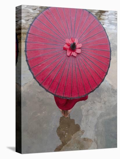Novice Monk Holding Alms Woks with Red Umbrella, Bagan, Myanmar-Keren Su-Stretched Canvas