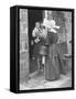 Nun from the Order of Sisters of Charity Visiting a Destitute Family with Supplies-null-Framed Stretched Canvas