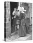 Nun from the Order of Sisters of Charity Visiting a Destitute Family with Supplies-null-Stretched Canvas