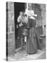 Nun from the Order of Sisters of Charity Visiting a Destitute Family with Supplies-null-Stretched Canvas