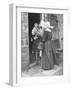 Nun from the Order of Sisters of Charity Visiting a Destitute Family with Supplies-null-Framed Photographic Print