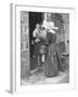 Nun from the Order of Sisters of Charity Visiting a Destitute Family with Supplies-null-Framed Photographic Print