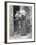 Nun from the Order of Sisters of Charity Visiting a Destitute Family with Supplies-null-Framed Photographic Print