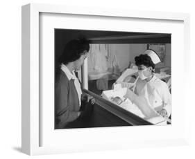 Nurse Aiko Hamaguchi shows new baby to mother in maternity ward, Manzanar War Relocation Center, CA-Ansel Adams-Framed Photographic Print