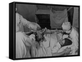 Nurse at Her Head and Holding Her Hands, as She Gazes at Her Baby Boy after "Painless" Childbirth-Alfred Eisenstaedt-Framed Stretched Canvas