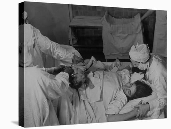 Nurse at Her Head and Holding Her Hands, as She Gazes at Her Baby Boy after "Painless" Childbirth-Alfred Eisenstaedt-Stretched Canvas