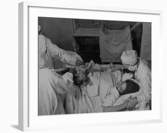 Nurse at Her Head and Holding Her Hands, as She Gazes at Her Baby Boy after "Painless" Childbirth-Alfred Eisenstaedt-Framed Premium Photographic Print