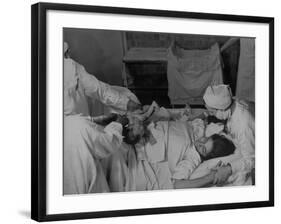 Nurse at Her Head and Holding Her Hands, as She Gazes at Her Baby Boy after "Painless" Childbirth-Alfred Eisenstaedt-Framed Premium Photographic Print