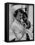 Nurse Holding African American Girl in Her Arms, Examining Her Finger-John Dominis-Framed Stretched Canvas