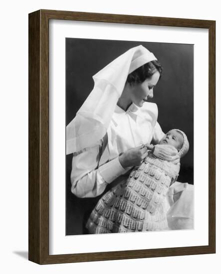 Nurse Holding Baby-null-Framed Photographic Print