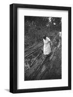 Nurse Maude Callen Carrying Her Medical Bag Along a Muddy Road after Caring for a Patient, 1951-W^ Eugene Smith-Framed Photographic Print