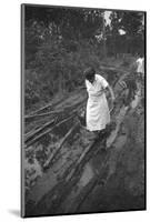 Nurse Maude Callen Carrying Her Medical Bag Along a Muddy Road after Caring for a Patient, 1951-W^ Eugene Smith-Mounted Photographic Print