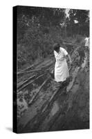 Nurse Maude Callen Carrying Her Medical Bag Along a Muddy Road after Caring for a Patient, 1951-W^ Eugene Smith-Stretched Canvas