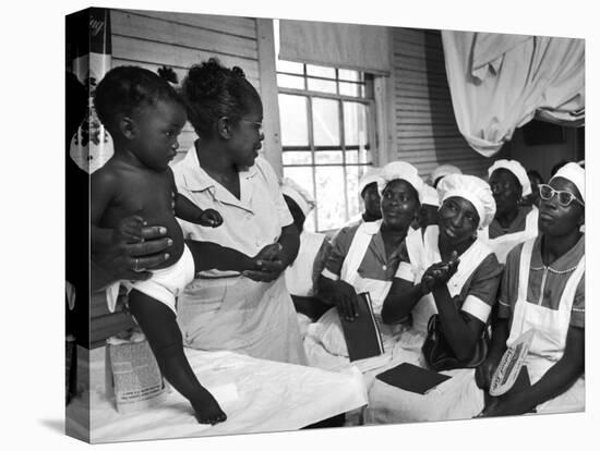 Nurse/Midwife Maude Callen Holds Baby and Teaches Class in Midwifery How to Look for Abnormalities-W^ Eugene Smith-Stretched Canvas