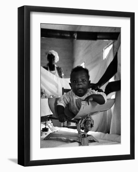 Nurse-Midwife Maude Callen Weighing Baby on Scale-W^ Eugene Smith-Framed Photographic Print