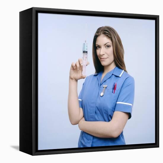 Nurse Pumping a Syringe-Kevin Curtis-Framed Stretched Canvas