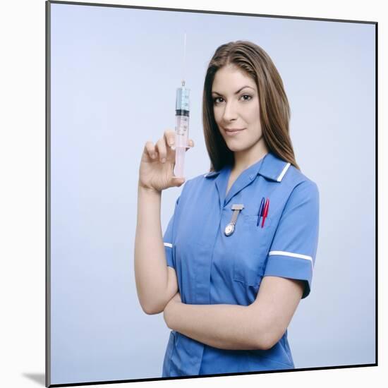 Nurse Pumping a Syringe-Kevin Curtis-Mounted Premium Photographic Print