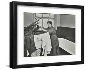 Nurse Using a Steriliser in the Bathroom at Chaucer Cleansing Station, London, 1911-null-Framed Photographic Print