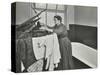 Nurse Using a Steriliser in the Bathroom at Chaucer Cleansing Station, London, 1911-null-Stretched Canvas