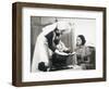 Nurse Weighs a Small Baby While Its Mother Watches-null-Framed Photographic Print
