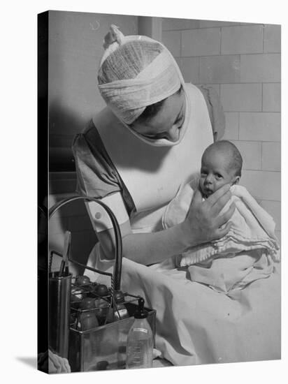 Nurse with Premature Baby-Hansel Mieth-Stretched Canvas