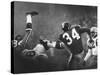 NY Giant Don Chandler Making a Punt in a Football Game Against the Green Bay Packers-John Loengard-Stretched Canvas
