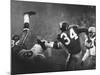 NY Giant Don Chandler Making a Punt in a Football Game Against the Green Bay Packers-John Loengard-Mounted Premium Photographic Print