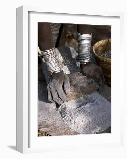 Nyagatom Woman Grinds Sorghum Using Two Stones, Omo River, South-Western Ethiopia-John Warburton-lee-Framed Photographic Print